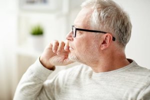 older man ponders the need for alcohol recovery for his son