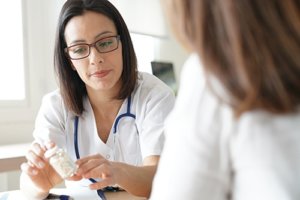 two doctors discussing medication management services