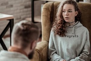 young woman learns about cognitive behavioral therapy