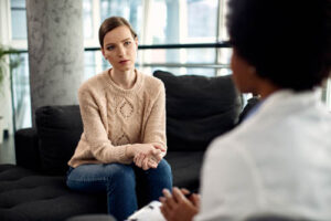 Woman talks to therapist, starts to heal in trauma therapy 