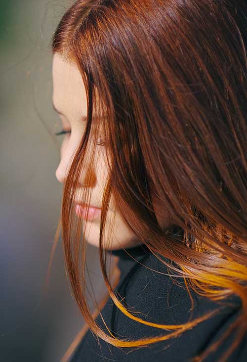 Teen girl with hair covering her face