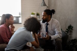 Therapist talks to patients during an ambulatory detox program session