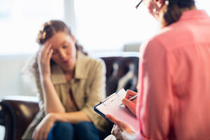 A substance abuse counselor conducts an intake assessment