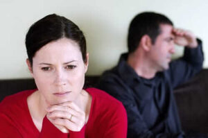A woman looks concerned while wondering if she needs substance abuse treatment.