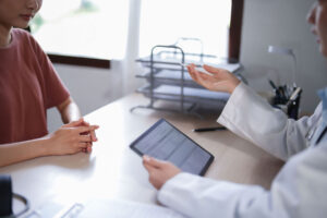Woman asks therapis if insurance covers addiction counseling