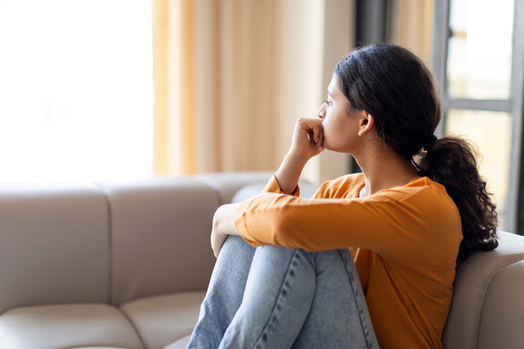 A woman wondering, "Does PTSD go away?"