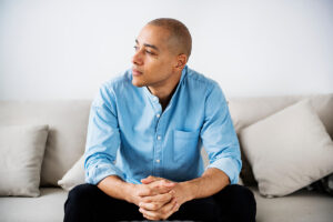 A man thinking about PTSD symptoms in men