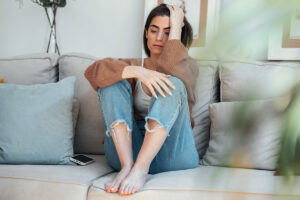A woman thinking about PTSD symptoms in women